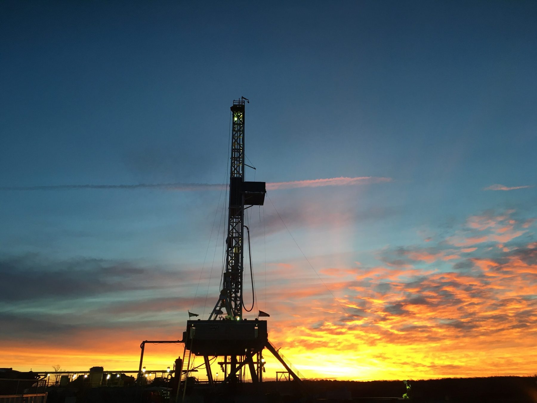 Drilling rig at sunset