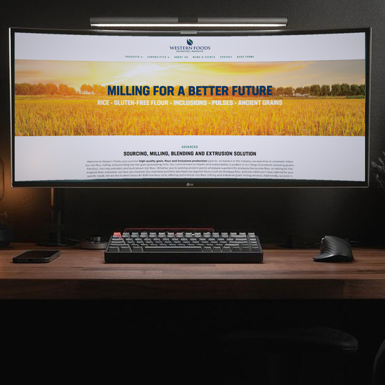 The Western Foods home page open full width on an ultrawide monitor in a dark office